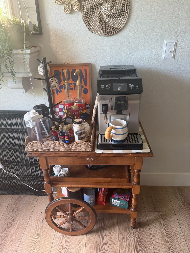 Cluttered coffee station before organizing the vintage tea cart