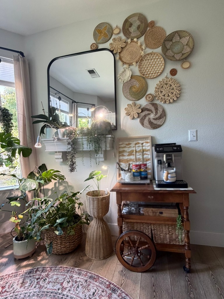 Cozy coffee station styled with plants and woven wall decor in a modern organic room